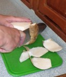 Using a knife to remove the tough skin of the jicama may be easier than a peeler.