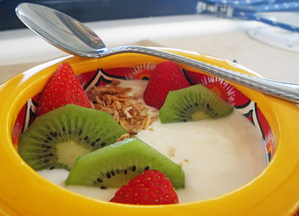 A bowl of boat-made yogurt with fruit and granola.