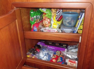 The snack cabinet holds munchies and quick foods for the crew.