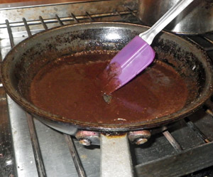 The sauce takes on a smooth consistency as the chocolate melts.