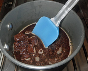 The chocolate melts easily in a pan with the liquid ingredients.