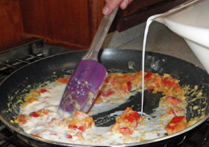 Milk is added to the roux to make the gravy.