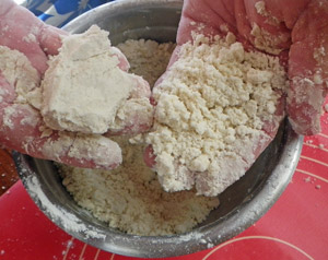 Mix in the lard until the dry ingredients take on a consistency like cornmeal.