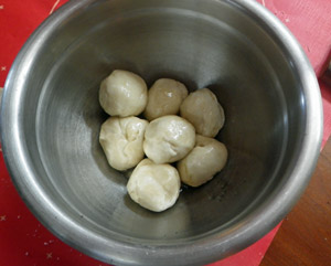 After being coated with lard the dough balls are allowed to rest from 15 minutes to two hours.