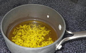 Olive oil and garlic paste are simmered as the base for the lemon sauce.
