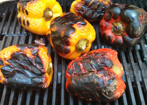 Peppers are grilled until the outsides are heavily charred.