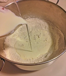 Cream is poured into the self-rising flour.